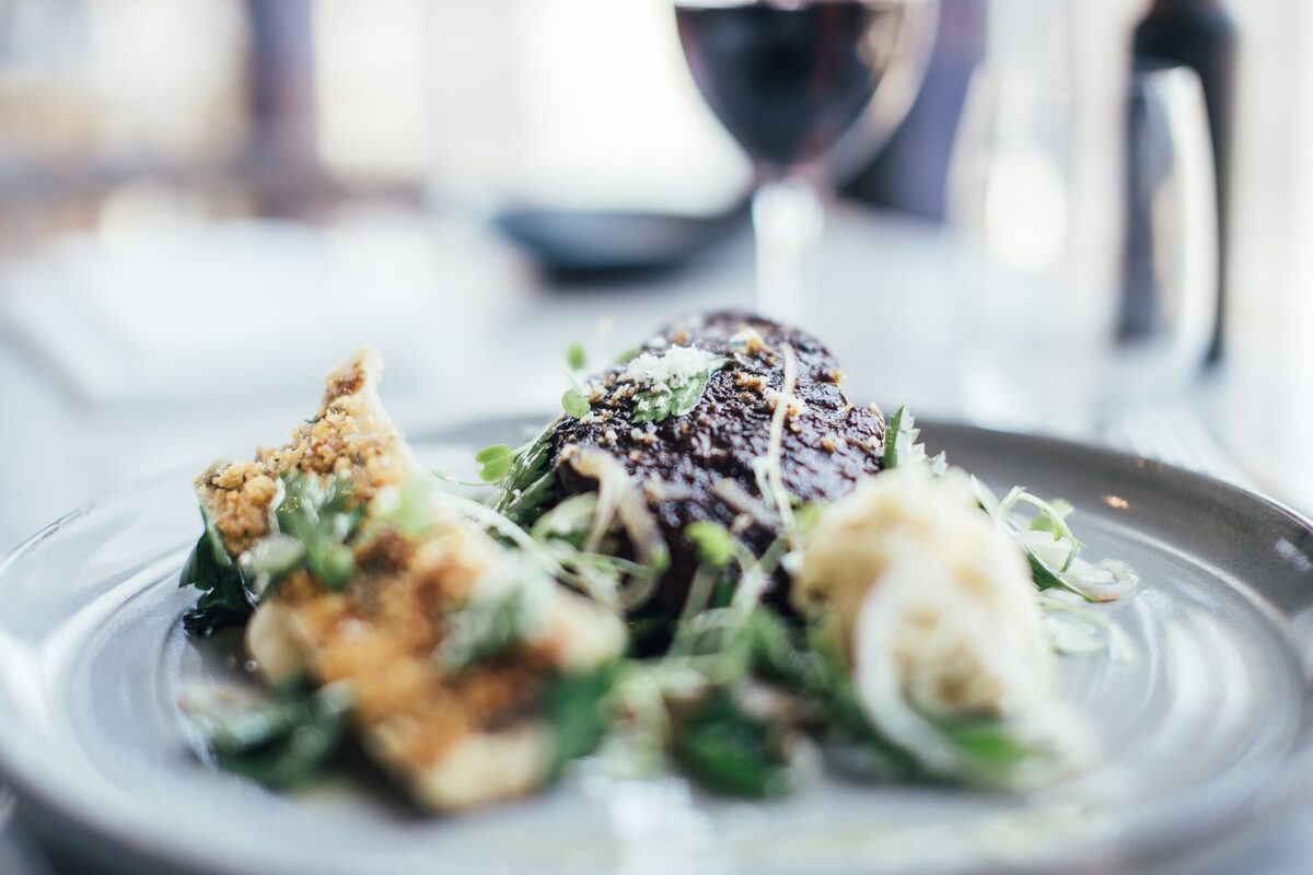 A plated main course served in Llewelyn's Restaurant at The Lion Hotel, Criccieth